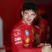 BUDAPEST, HUNGARY - AUGUST 02: Charles Leclerc of Monaco and Scuderia Ferrari greets a teammate in the garage during final practice ahead of the F1 Grand Prix of Hungary at Hungaroring on August 02, 2025 in Budapest, Hungary. (Photo by Mark Thompson/Getty Images)