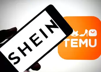 INDIA - 2025/08/07: In this photo illustration, a SHEIN logo is seen displayed on a smartphone with a TEMU logo in the background. (Photo Illustration by Avishek Das/SOPA Images/LightRocket via Getty Images)