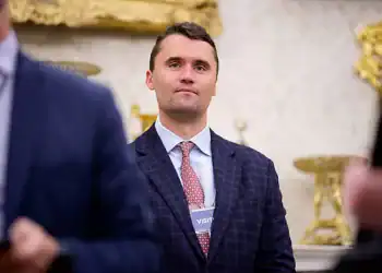 WASHINGTON, DC - MAY 28: Turning Point USA co-founder Charlie Kirk stands in the back of the room as U.S. President Donald Trump speaks during a swearing in ceremony for interim U.S. Attorney for Washington, D.C. Jeanine Pirro in the Oval Office of the White House on May 28, 2025 in Washington, DC. Trump has announced Pirro, a former Fox News personality, judge, prosecutor, and politician, after losing support in the Senate for his first choice, Ed Martin, over his views on the January 6, 2021 attack on the U.S. Capitol. (Photo by Andrew Harnik/Getty Images)