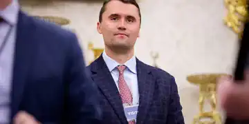 WASHINGTON, DC - MAY 28: Turning Point USA co-founder Charlie Kirk stands in the back of the room as U.S. President Donald Trump speaks during a swearing in ceremony for interim U.S. Attorney for Washington, D.C. Jeanine Pirro in the Oval Office of the White House on May 28, 2025 in Washington, DC. Trump has announced Pirro, a former Fox News personality, judge, prosecutor, and politician, after losing support in the Senate for his first choice, Ed Martin, over his views on the January 6, 2021 attack on the U.S. Capitol. (Photo by Andrew Harnik/Getty Images)