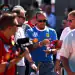 MONZA, ITALY - SEPTEMBER 06: Lewis Hamilton of Great Britain and Scuderia Ferrari signs autographs for fans prior to final practice ahead of the F1 Grand Prix of Italy at Autodromo Nazionale Monza on September 06, 2025 in Monza, Italy. (Photo by Clive Rose/Getty Images)