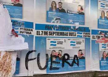 RAMOS MEJIA, ARGENTINA - SEPTEMBER 7: Vandalized banners of Legislative Candidate Veronica Magario for Fuerza Patria party are stuck on a billboard during legislative elections on September 7, 2025 in Ramos Mejia, Argentina. The province of Buenos Aires hold legislative elections to renew 46 representatives and 23 provincial senators. (Photo by Tobias Skarlovnik/Getty Images)