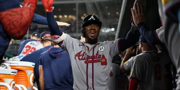 WASHINGTON, DC - SEPTEMBER 15: Ozzie Albies #1 of the Atlanta Braves celebrates with teammates in the dugout after scoring a run against the Washington Nationals during the ninth inning at Nationals Park on September 15, 2025 in Washington, DC. (Photo by Scott Taetsch/Getty Images)