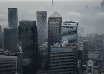 LONDON - Nov. 5, 2020: Fog shrouds the Canary Wharf business district including global financial institutions Citigroup Inc., State Street Corp., Barclays Plc, HSBC Holdings Plc and the commercial office block No. 1 Canada Square.