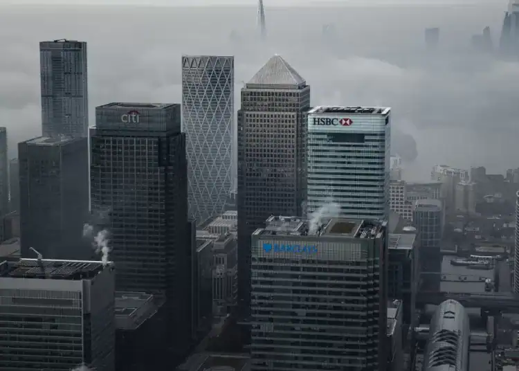 LONDON - Nov. 5, 2020: Fog shrouds the Canary Wharf business district including global financial institutions Citigroup Inc., State Street Corp., Barclays Plc, HSBC Holdings Plc and the commercial office block No. 1 Canada Square.