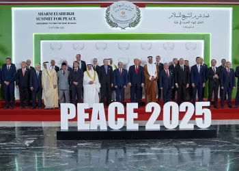 US President Donald Trump (C) and other world leaders pose for a group photograph at the Sharm El-Sheikh Peace Summit in the Egyptian Red Sea resort town of Sharm el-Sheikh on October 13, 2025. Trump on October 13 hailed a Gaza summit in Egypt as a "tremendous day" for the Middle East, saying a document would be signed on "rules and regulations" for future talks. (Photo by Evan Vucci / POOL / AFP)