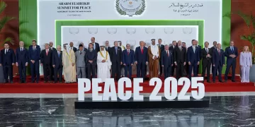 US President Donald Trump (C) and other world leaders pose for a group photograph at the Sharm El-Sheikh Peace Summit in the Egyptian Red Sea resort town of Sharm el-Sheikh on October 13, 2025. Trump on October 13 hailed a Gaza summit in Egypt as a "tremendous day" for the Middle East, saying a document would be signed on "rules and regulations" for future talks. (Photo by Evan Vucci / POOL / AFP)