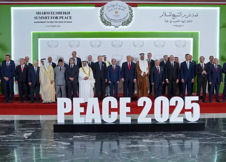 US President Donald Trump (C) and other world leaders pose for a group photograph at the Sharm El-Sheikh Peace Summit in the Egyptian Red Sea resort town of Sharm el-Sheikh on October 13, 2025. Trump on October 13 hailed a Gaza summit in Egypt as a "tremendous day" for the Middle East, saying a document would be signed on "rules and regulations" for future talks. (Photo by Evan Vucci / POOL / AFP)