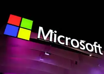 The Microsoft logo, representing the American multinational corporation and technology company best known for its software products Windows, the line of operating systems, Microsoft 365, the suite of productivity applications that includes Word, Excel, or PowerPoint, and its hardware products, Xbox and Microsoft Surface, is considered one of the Big Five American IT companies and is founded by Bill Gates. The logo is on their pavilion during the Mobile World Congress 2025 in Barcelona, Spain, on March 5, 2025. (Photo by Joan Cros/NurPhoto via Getty Images)