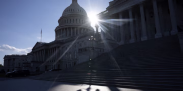 Sun sets on the 34th day of the government shutdown on Capitol Hill in Washington, DC, on November 3, 2025. The federal government shutdown has entered its second month. Since partisan gridlock sent the US government into shutdown October 1, many federal workers have gone without paychecks and millions of Americans are increasingly caught in the crossfire of a lack of basic federal services. (Photo by Jim WATSON / AFP)