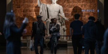 Visitors walk through the American History museum on the first day of the Smithson museum openings after the US Government reopened on the National Mall in Washington, DC on November 14, 2025. After 43 days, the waiting came to an end on November 14, 2025, when President Donald Trump signed a bill funding the government through January -- the result of a deal brokered by Republicans and a handful of moderate Democratic lawmakers. (Photo by ANDREW CABALLERO-REYNOLDS / AFP)