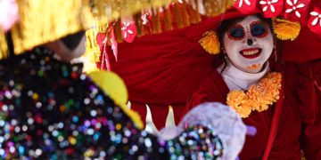 A person dressed as La Catrina is seen at Zocalo in Mexico City, Mexico on October 27, 2025. (Photo by Jakub Porzycki/NurPhoto via Getty Images)