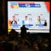A screen shows the first exit poll results at the bunker of Colombia's presidential candidate from the ruling party Pacto Historico, Ivan Cepeda, during the presidential election in the Tequendama Hotel in Bogota on May 31, 2026. (Photo by Raul ARBOLEDA / AFP)
