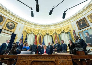 US President Donald Trump, center, during an executive order signing in the Oval Office of the White House in Washington, DC, US, on Monday, July 13, 2026. Trump shrank Utah's Bears Ears and Grand Staircase-Escalante national monuments Monday, opening the door to possible drilling, mining, and other development on formerly-protected lands. Photographer: Aaron Schwartz/CNP/Bloomberg via Getty Images