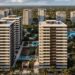 Vista aérea de un desarrollo residencial en Punta Cana, República Dominicana, con piscinas y zonas verdes