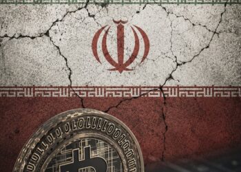 Pantalla con gráficos de criptomonedas y símbolo de candado de seguridad representando sanciones financieras internacionales contra plataformas iraníes