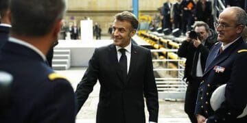 France's President Emmanuel Macron (C) greets French Navy members after delivering a speech next to nuclear-powered ballistic missile submarine (SSBN) submarine "Le Temeraire" - S617 during his visit to the Nuclear Submarine Navy Base of Ile Longue in Crozon, north-western France on March 2, 2026. High expectations, few certainties: on March 2, 2026, Emmanuel Macron is set to outline how France's nuclear deterrent can help strengthen security in Europe in the face of a increasingly brutal world and an increasingly uncertain US ally. This issue has been brought sharply into focus by the Israeli-US offensive in Iran this weekend, against the backdrop of the Iranian nuclear crisis, which is shaking the entire Middle East and, by extension, the international community. (Photo by Yoan VALAT / POOL / AFP via Getty Images)