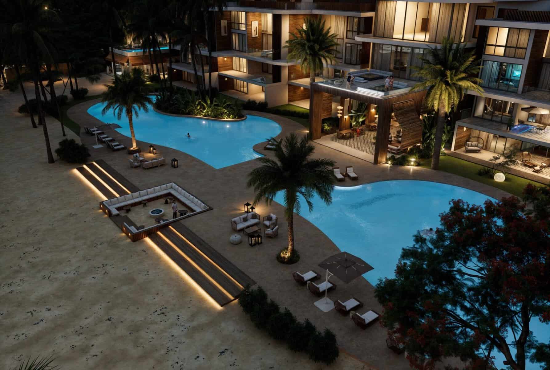 Render nocturno del complejo residencial ICON Cabarete con piscinas iluminadas y acceso a la playa.